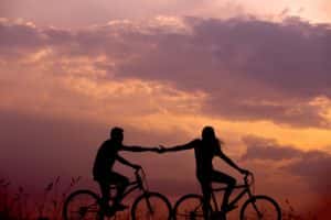 People Riding Bicycle at Sunset